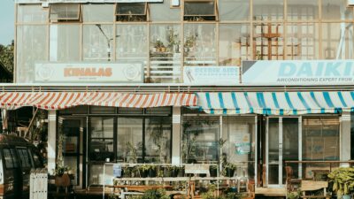 Charming street scene featuring local shops with colorful striped awnings